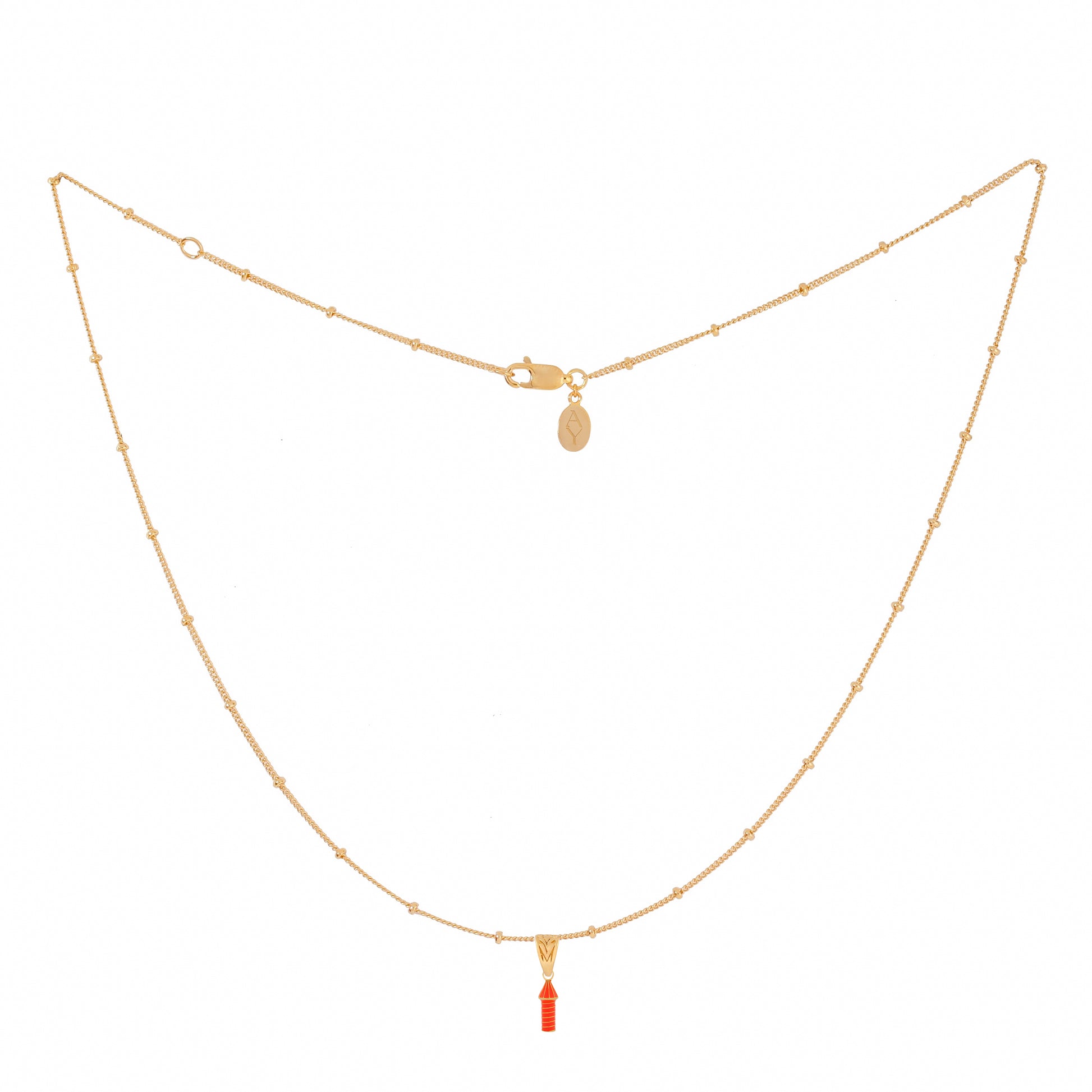 image of rocket enamel necklace showing full length ball chain and pendant on white background