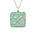 A square-shaped necklace pendant with a crest motif design, featuring chrysoprase and natural emeralds, set in recycled sterling silver, displayed on a chain.