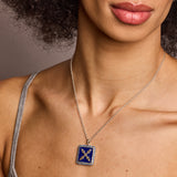 Introvert crest necklace in sapphire and lapis on bare chest