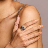Lapis Introvert Stone Signet Ring in silver on model holding arm with hand
