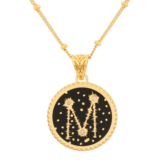 image of sparkler diamond initial necklace in black and gold, letter M, showing close-up of pendant on white background