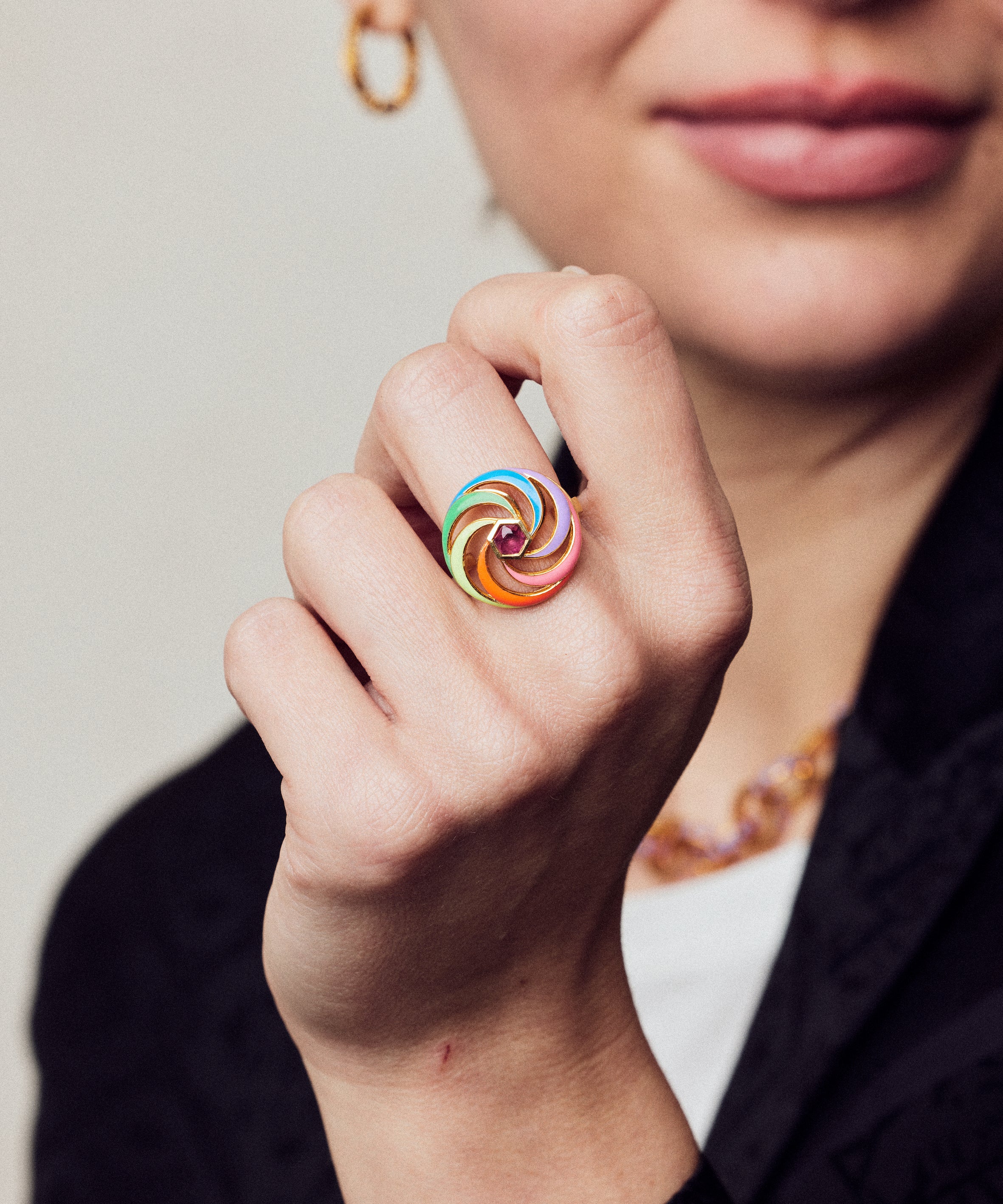 image of spinning ring on model with closed hand in forefront