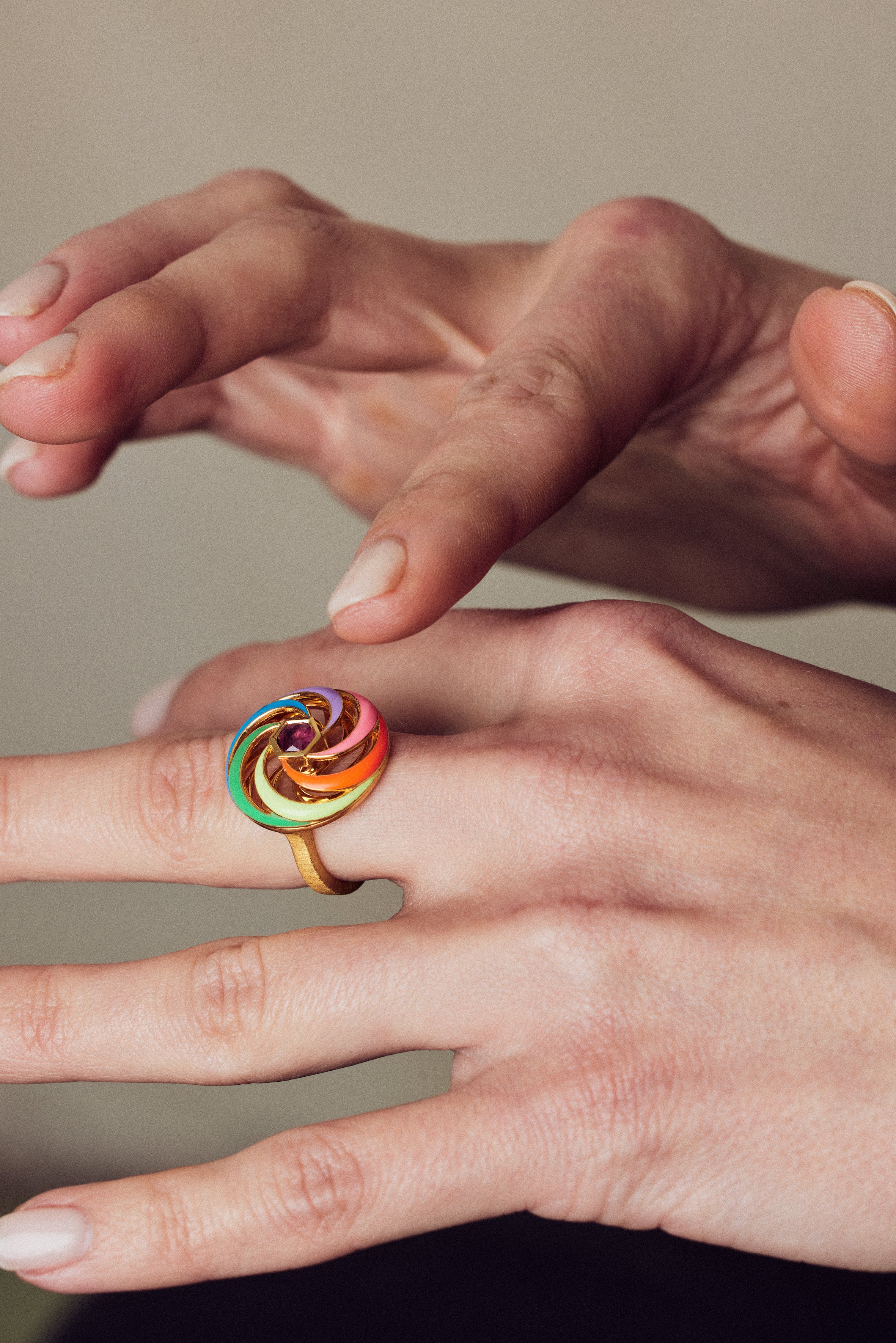 image of spinning ring on hands still frame showing disk being spun