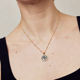 image of sparkler diamond initial necklace, letter C on short chain, on model in black tank top