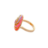 image of Catherine Spinning Ring with multi-coloured enamel and ruby hexagon centre, side view on a white background