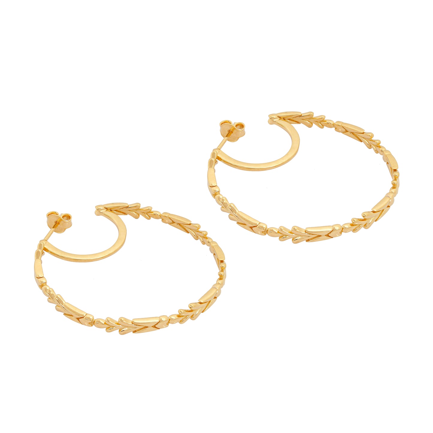 image of large firework gold hoop earrings lying flat view from the side on white background