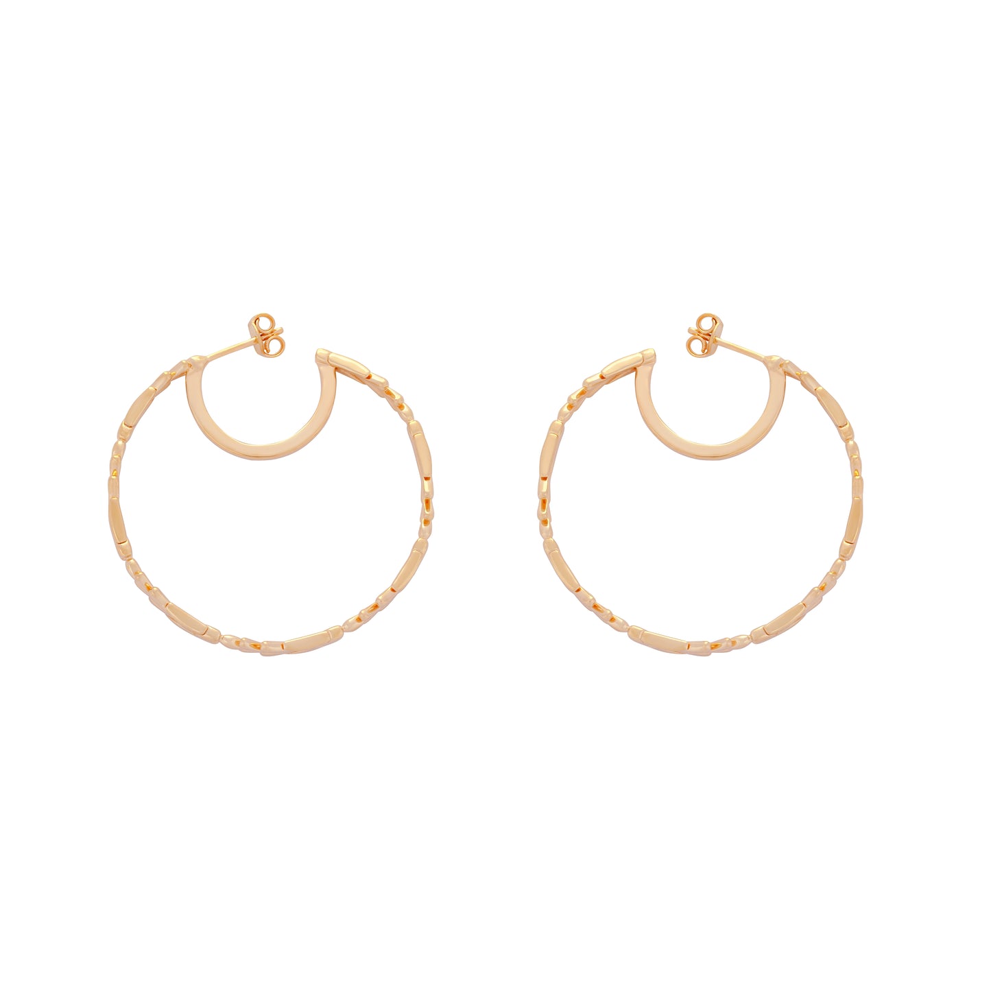 image of large firework gold hoop earrings lying flat on white background