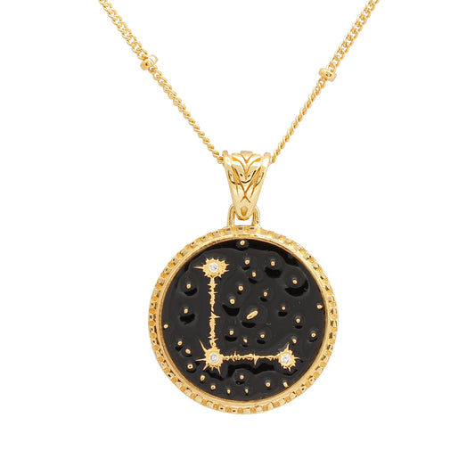 image of sparkler diamond initial necklace in black and gold, letter L, shown close up of pendant on white background