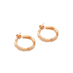 image of firework medium gold hoop earrings lying flat on white background